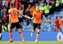 Dundee United's Liam Smith celebrates scoring their side's first goal of the game with team-mate Ross Graham during the cinch Premiership match at Ibrox
