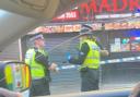 Street taped off in Glasgow as man rushed to hospital