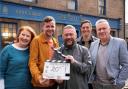 River City and Balamory star poses with decorators at Glasgow home