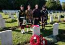 The party from 4th Battalion The Royal Regiment of Scotland at the graveside of Second Lieutenant Boyd at Raperie British Cemetery, in Villemontoire, France