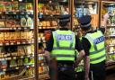 Detectives seen 'taking photos' after incident at convenience store