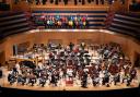 Young musicians perform on stage with Royal Scottish National Orchestra