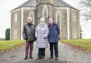 Raymond Anderson, Margaret Whyte and Joe Graham outside Johnstone High Parish Church