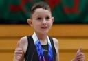 Schoolboy missing part of spine becomes talented gymnast