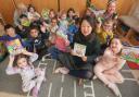 Layla Yang read to the children in traditional Mandarin