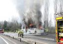 Bus bursts into flames on busy road in shocking scenes