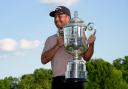 Xander Schauffele holds the Wanamaker Trophy after winning the US PGA Championship (Sue Ogrocki/AP)