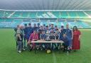 Glasgow under-18s team celebrate cup win after match at Celtic Park