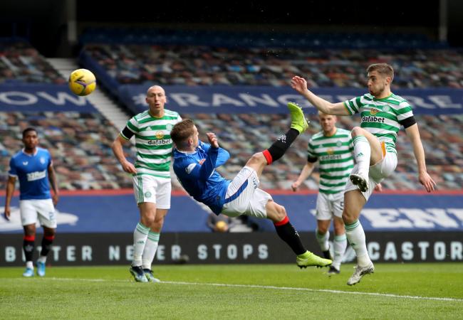 Rangers' Steven Davis (centre) scores against Celtic