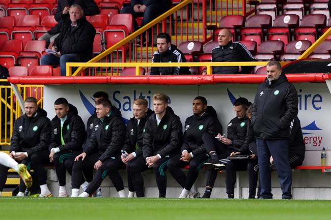 Ange Postecoglou, right, and his Celtic players at Pittodrie today