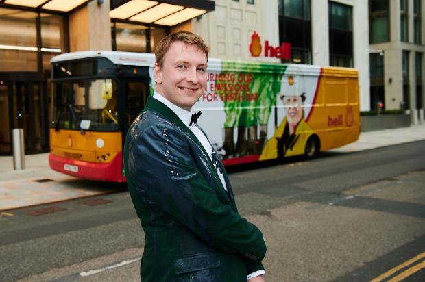 Glasgow Times: Joe Lycett outside of Shell's Headquarters in London, perfoming a stunt as part of his documentary Joe Lycett vs The Oil Giant. Credit: Channel 4