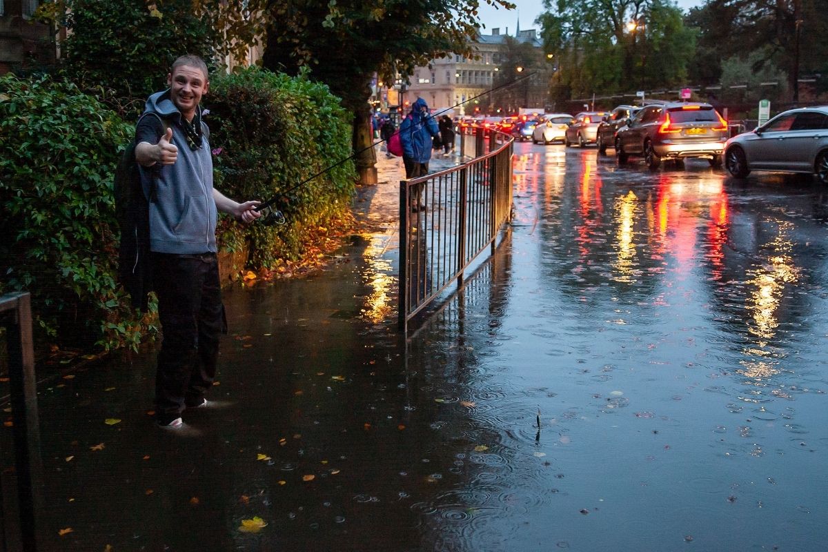 Man starts FISHING in giant puddle as Glasgow floods