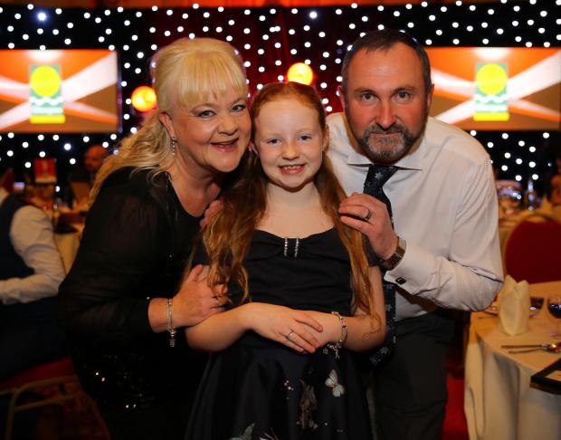 Glasgow Times: Glasgow Times Community Champion Awards 2021, City Chambers, Glasgow. Winner of the Individual Award North East.is Heather Bryson - Lockdown Crafts By H. and Lockdown Exercise By H. - Winner. She is pictured with mum Deborah and dad Gary....Photograph by