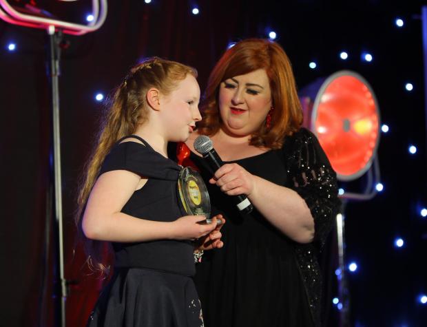 Glasgow Times: Glasgow Times Community Champion Awards 2021, City Chambers, Glasgow. Winner of the individual award is Heather Bryson age 9 - Lockdown Crafts By H. and Lockdown Exercise By H. Pictured talking with host Michelle McManus...Photograph by Colin Mearns.1