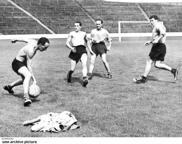Glasgow Times: SHIRTS WERE USED AS GOALPOSTS AT IBROX IN A WEE GAME DURING RANGERS TRAINING SESSION. AND HERE IAN McCOLL STOPS A HOT SHOT FROM ALEX SCOTT (RIGHT) RALPH BRAND AND JOHNNY HUBBARD ARE READY TO TAKE ADVANTAGE OF ANY SLIPS.NEWSQUEST MEDIA GROUP