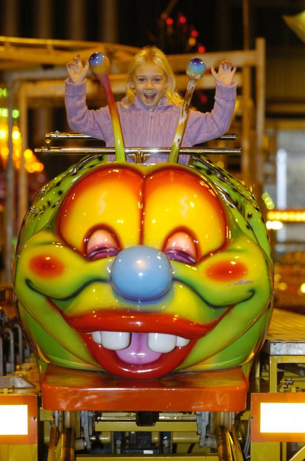 Glasgow Times: A little girl enjoys the carnival at the SEC in 2004