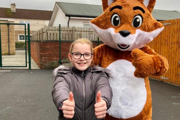 Glasgow Times: [Peyton Gallagher, 11, with Cuthbert the fox.] 