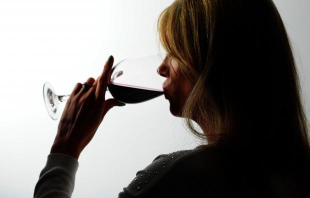 Glasgow Times: A woman drinking red wine. Credit: PA
