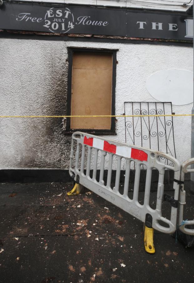 Glasgow Times: Pictured: A window is damaged at the Dalmarnock Inn Pub Photo: Gordon Terris