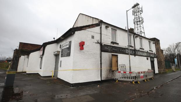 Glasgow Times: Pictured: The Dalmarock Inn Pub remained taped off this afternoon Photo: Gordon Terris