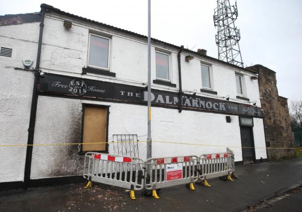 Glasgow Times: Pictured: The Dalmarock Inn Pub was set on fire this morning Photo: Gordon Terris