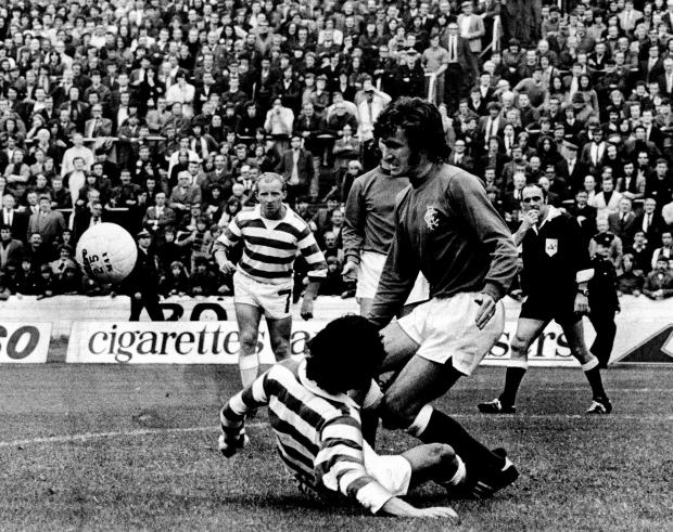 Glasgow Times: Jardine of Rangers clears from Macari of Celtic, 1972