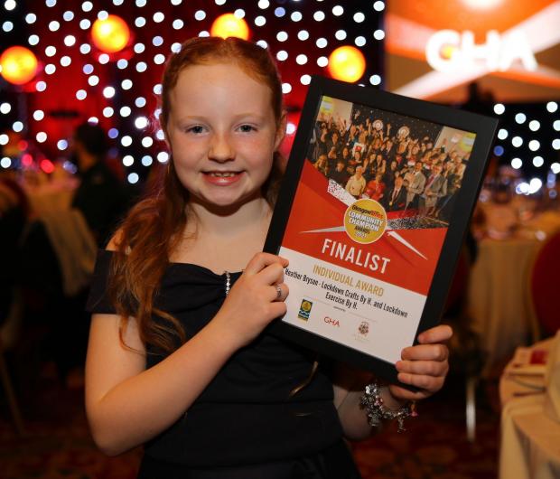 Glasgow Times: Heather Bryson with her Community Champions award. Pic: Colin Mearns