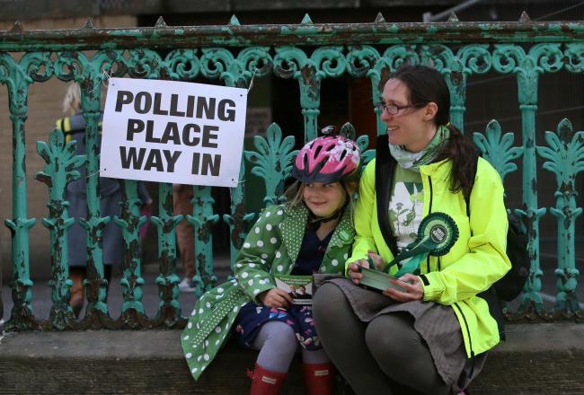 Waiting outside a polling station  Picture: Colin Mearns
