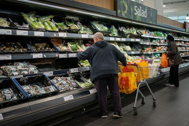 Glasgow Times: EMBARGOED TO 0001 SATURDAY NOVEMBER 6 File photo dated 15/10/21 of shoppers in the fruit and vegetables section of a branch of Sainsbury's in London. The bosses of five of the UK's biggest supermarkets have promised to halve the environmental