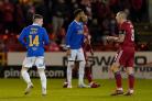 Aberdeen captain Scott Brown, right, goads Ryan Kent after the Rangers winger had been red carded at Pittodrie