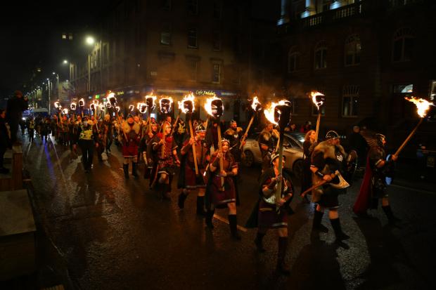 Glasgow Times: Shetland Vikings marching through Glasgow city centre. [Photograph by Colin Mearns]