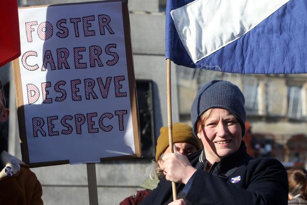 Glasgow Times: Jane Wright, Chair of Foster Care Workers Union joins Members of the Independent Workers' Union of Great Britain (IWGB) demonstrate in George Square in Glasgow tuesday coinciding with Uber workers' rights case at Court of Appeal and the first