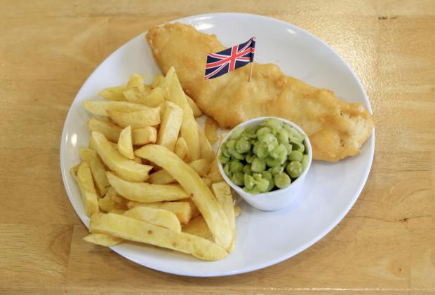 Glasgow Times: Fish, chips and mushy peas. Credit: PA