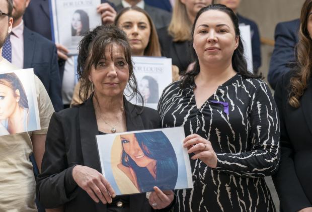 Glasgow Times: Caroline Lyon, from East Kilbride, alongside Scottish Labour's Monica Lennon (right), holds a photograph of her late daughter Louise Aitchison at the Scottish Parliament in Holyrood, Edinburgh.