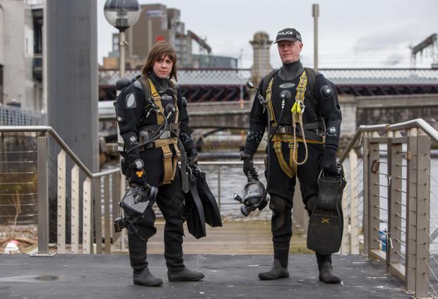 Glasgow Times: Members of the Police Dive and Marine unit pictured on the River Clyde at the Broomielaw in Glasgow. Divers Louise Muir and Jim Miller pictured on the pontoon at the Broomielaw...Photograph by Colin Mearns.16 March 2022.For Glasgow Times, see story by