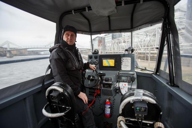 Glasgow Times: Members of the Police Dive and Marine unit pictured on the River Clyde at the Broomielaw in Glasgow. Pictured is Robert McCallum on the helm of the Police RIB...Photograph by Colin Mearns.16 March 2022.For Glasgow Times, see story by Cat Stewart.