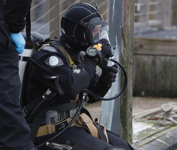 Glasgow Times: Members of the Police Dive and Marine unit pictured on the River Clyde at the Broomielaw in Glasgow. Pictured is  police diver Louise Muir getting ready to enter the water...Photograph by Colin Mearns.16 March 2022.For Glasgow Times, see story by Cat