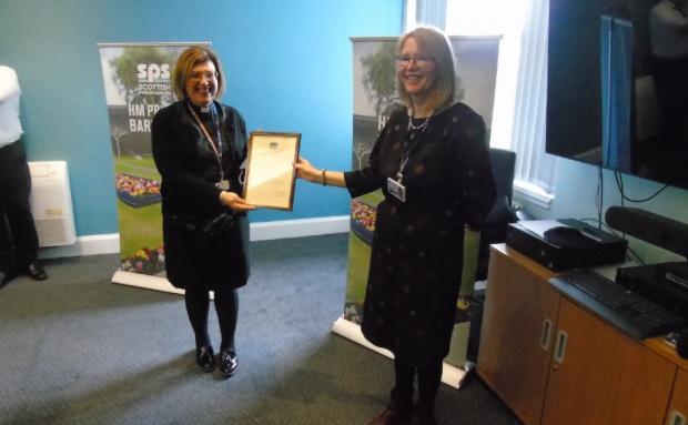 Glasgow Times: Mrs Clancy being presented with her award by Teresa Medhurst