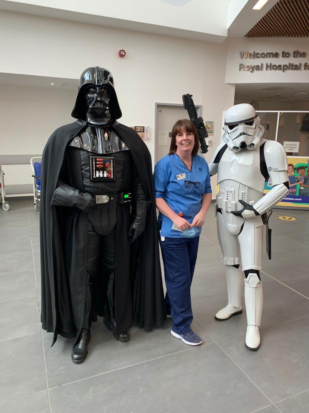 Glasgow Times: Darth Vader and a Stormtrooper on a ward visit at the Royal Hospital for Children in Glasgow.