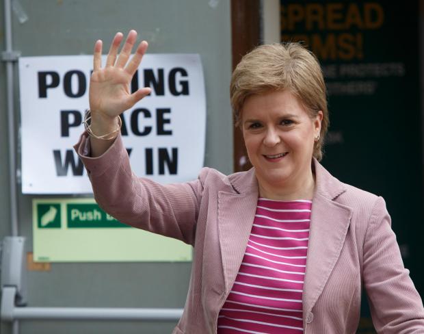Glasgow Times: Nicola Sturgeon at the polling station at Broomhouse community centre in Baillieston, Glasgow