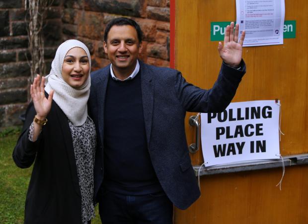 Glasgow Times: Anas Sarwar, leader of Scottish Labour and wife Furheen at the polling place at Pollokshields Burgh hall in Glasgow for the council elections