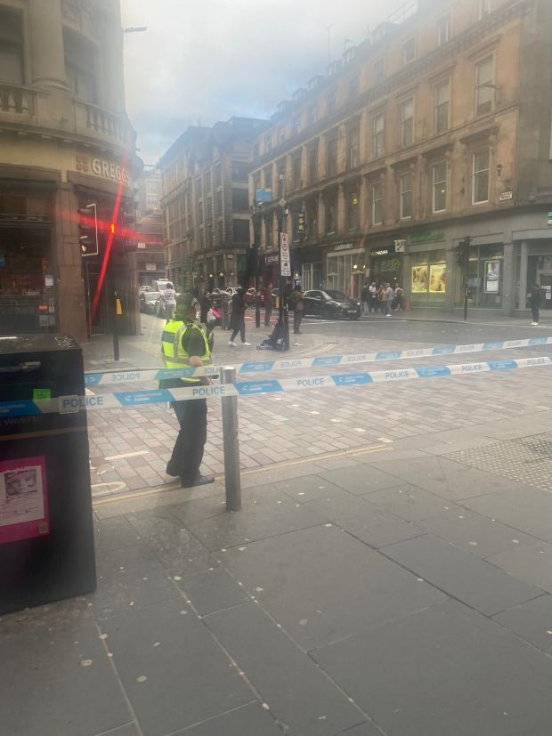 Glasgow Times: Officers are guarding the locked-down area