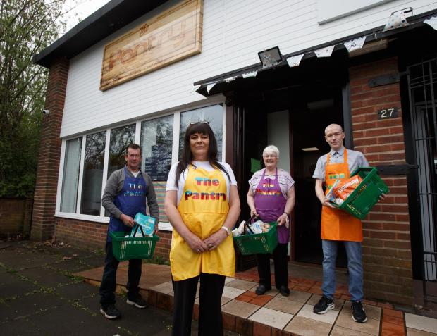 Glasgow Times: Pollok Pantry manager Tracy Galligan, second from left pictured with volunteers, from left - Grant McMillan, Tracy, Julia Allan and Darren Montgomery