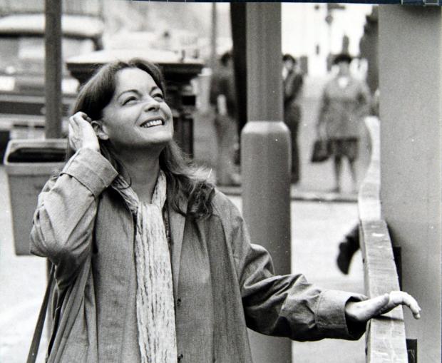 Glasgow Times: FILMING OF DEATH WATCH IN BATH STREET , GLASGOW. ROMY SCHNEIDER LAUGHS AS SHE WATCHES A BILL POSTER RETOUCHING HER PICTURE .STAFF PIC TAKEN PIC:  STUART PATERSON