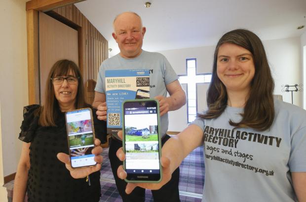 Glasgow Times: From left, Sharon Bowers of the Acre Tenants association, Jim Hamilton, of MAryhill Parish Church and Iona Craig Community Outreach worker with Maryhill Church, all using and updating the Maryhill Activity Directory app