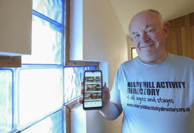 Glasgow Times: Jim Hamilton of Maryhill Parish Church using and updating the Maryhill Activity Directory app