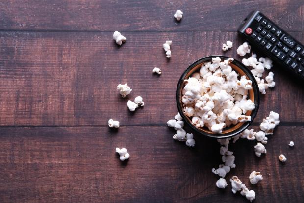 Glasgow Times: A bowl of popcorn and a TV remote (Canva)
