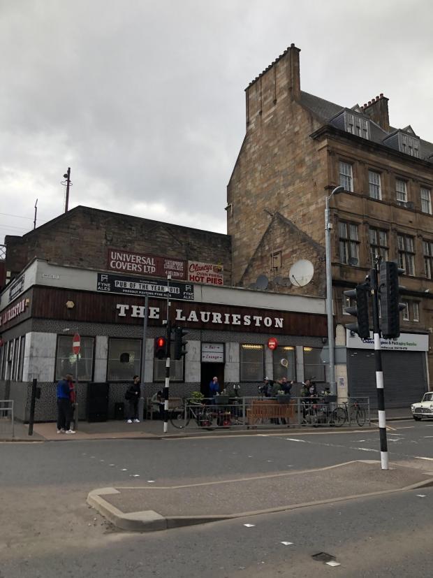 Glasgow Times: Vintage adverts appeared on the wall overlooking The Laurieston.