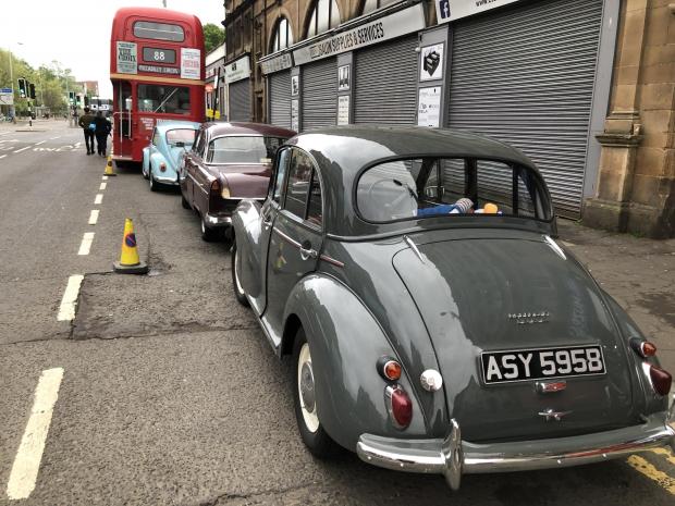 Glasgow Times: Several vintage cars, a double-decker London bus and a black can were parked on Bridge Street.