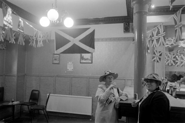 Glasgow Times: Golden Jubilee celebrations of Queen Elizabeth II. -  Jubilee celebrations inside a pub in Bridgeton, in Glasgow, Scotland, 2nd June 2002.Jeremy Sutton-Hibbert